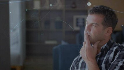 Poster - Animation of network of connections and light spot against thoughtful caucasian man at home