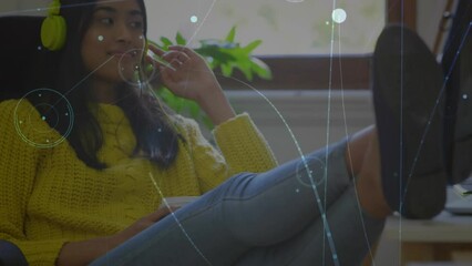Poster - Animation of network of connections against african american woman listening to music at home