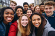 © RCH Photographic - Multi ethnic group of happy young adults posing together for a selfie young smiling multiracial group of people Group of multi-ethnic teen friends