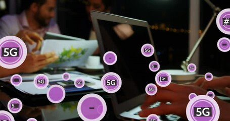 Poster - Animation of 5g text in circles , diverse coworkers discussing reports and working on laptop