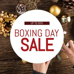 Poster - Composite of upto 60 percent boxing day sale text over caucasian hands wrapping gift boxes on table