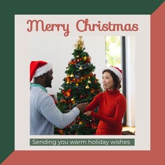 Sticker - Composite of merry christmas text and diverse friends in santa hats decorating christmas tree