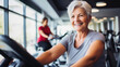 © Vivid Pixels - Older woman smiling while exercising at the gym to stay healthy in her senior years
