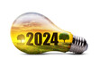 Eco LED light bulb with number 2024 isolated on a transparent background, PNG. Green energy or Happy New Year concept.