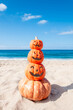 Four pumpkins on the beach - Halloween background