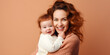Happy Mom holding baby, isolated on soft colour background