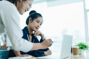 Wall Mural - startup business, business advisor explaining strategy for planning finance investment teamwork paperwork audit and discussing marketing, profit, budget of company in meeting room.