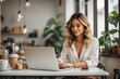 © Athena  - beautiful woman using a laptop Managing a coffee shop
