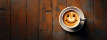 Top View Of A Cup Of Coffee With Cream With Smiley Drawn On Top