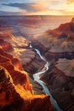 Fototapeta Zachód słońca - Awe-inspiring Landscape featuring a Grand Canyon with a river flowing through it