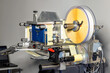 Applicator of self-adhesive labels in a drum roll.