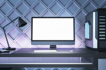Poster - Creative gamers desktop with empty white computer screen, lamp and system unit on decorative blue wall background. Gaming concept. Mock up, 3D Rendering.