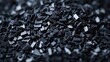 Close up photo of black plastic chips raw materials for the chemical industry