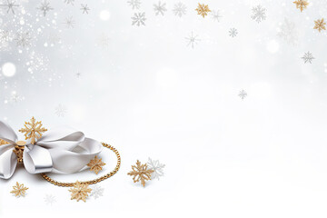 Wall Mural - Jewelry gold chain with a bow on a white background with decorative falling snowflakes. Free space for product placement or advertising text.