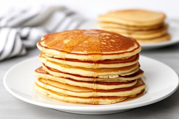 Canvas Print - stacks of plain pancakes on a plain white plate