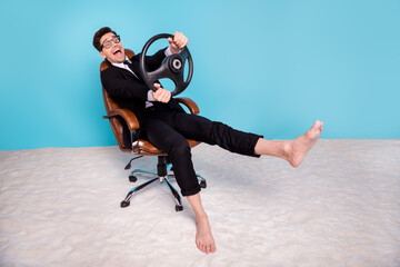 Sticker - Full length photo of cheerful positive guy dressed black tuxedo driving vehicle vacation empty space isolated blue color background