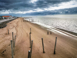 Wall Mural - Poles on Hjerting public beach promenade in Esbjerg, Denmark