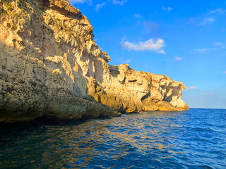 Sea grottoes and caves of Sicily. Sea Caves Tour Ortigia in Siracusa.  Sea grottoes of Syracuse. Boat trip in Sicily, coastal cliffs