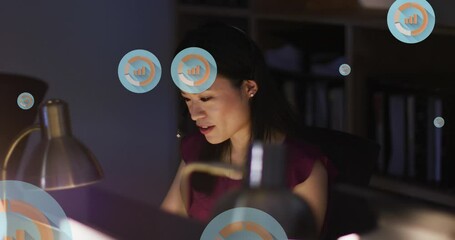 Poster - Animation of multiple graph icons over asian woman discussing during video call on laptop