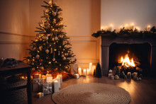 Beautiful Christmas Tree With Gifts In A Living Room With Fireplace
