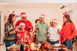 Group of happy family smiling happy celebrating christmas toasting with wine. Family member enjoy home made turkry grill dining togather at home. Christmas and New Year interior concept.