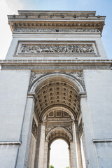 Wall Mural - Arc de Triomphe, one of the most famous monuments in Paris, massive triumphal arch, located near Champs-Elysees in Paris. Close up, selective focus