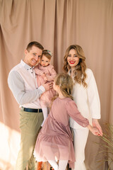 Wall Mural - happy family of four father with mother and two daughters