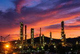 Fototapeta  - Oil​ refinery​ and​ plant and tower column of Petrochemistry industry in oil​ and​ gas​ ​industrial with​ cloud​ red​ ​sky the evening​ sunset