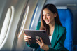 © R Photography - Female airplane passengers asian chinese people Entrepreneurs on Flight, Venturing Overseas Investments. Global Business Expansion, Foreign Markets, Strategic Financial Moves. Women in Business Suits