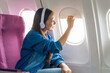 Female airplane passengers traveller asian chinese people discovering global destinations. jet-setting adventures, empowered explorations, immersive cultural experiences.