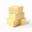 Cubes of yellow cheese stacked randomly on white.
