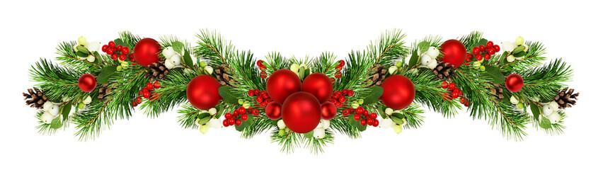snowberries with green twigs of christmas tree, red decorations and cones in a holiday waved garland