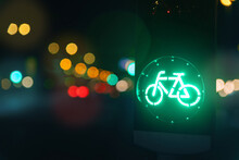 Bicycle Green Allowing Lamp Sign On Traffic Light Road Highway Driveway Drive Crossroad Intersection Evening Dark Time German City. Bike Forward Movement Safe On Semaphore Signal City Street