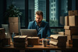 man in the office at a table filled with cardboard boxes