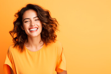 a female model, looking at camera, light orange background with copy space