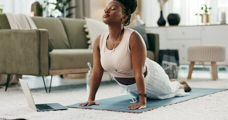 Poster - Yoga, laptop and zen with a black woman on the floor of a living room in her home for health or wellness. Exercise, computer and mental health with a young person in her apartment for mindfulness