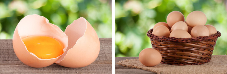 Wall Mural - Broken egg with yolk and eggshell On a wooden table with a blurry garden background