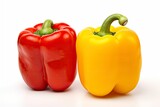 Fototapeta Kuchnia - Two bell peppers, a red and a yellow isolated on white background.