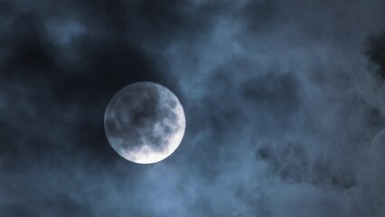 Wall Mural - night sky magic. time lapse of full moon and moving clouds. clouds overlapping the moon. mystical, h