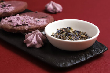 Dried lavender flowers in a white plate. Close-up