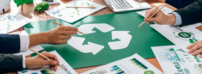 Wall Mural - Group of business people planning and discussing on recycle reduce reuse policy symbol in office meeting room. Green business company with eco-friendly waste management regulation concept.Trailblazing