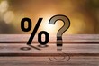 © BillionPhotos.com - Percentage with question mark on table, raising  Fed interest