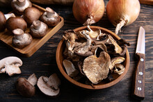 Slices Of Different Dried Mushrooms In A Wooden Bowl As Gourmet Food Ingredients, Vegetable Organic Protein Trend Food.