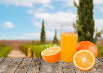 Wall Mural - Fresh sweet orange juice in glass on table