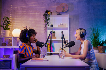 Wall Mural - A shocked african woman is sitting in a podcast studio with a host