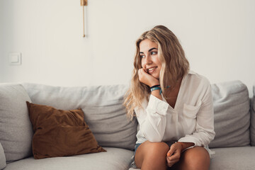 Wall Mural - Happy young woman look in distance feeling positive and optimistic, dream or visualizing of new beginning, smiling millennial girl thinking overjoyed excited for future, happiness, good mood concept.