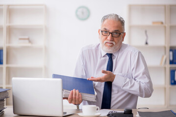 Old male employee and too much work in the office