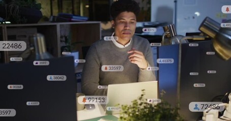 Poster - Animation of multiple notification bars over biracial man analyzing and preparing reports on laptop
