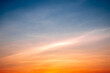 © ISENGARD - Beautiful of luxury soft gradient orange gold clouds and sunlight on the blue sky perfect for the background, take in everning,Twilight
