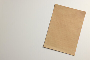 Sticker - Sheet of old parchment paper on white background, top view. Space for text